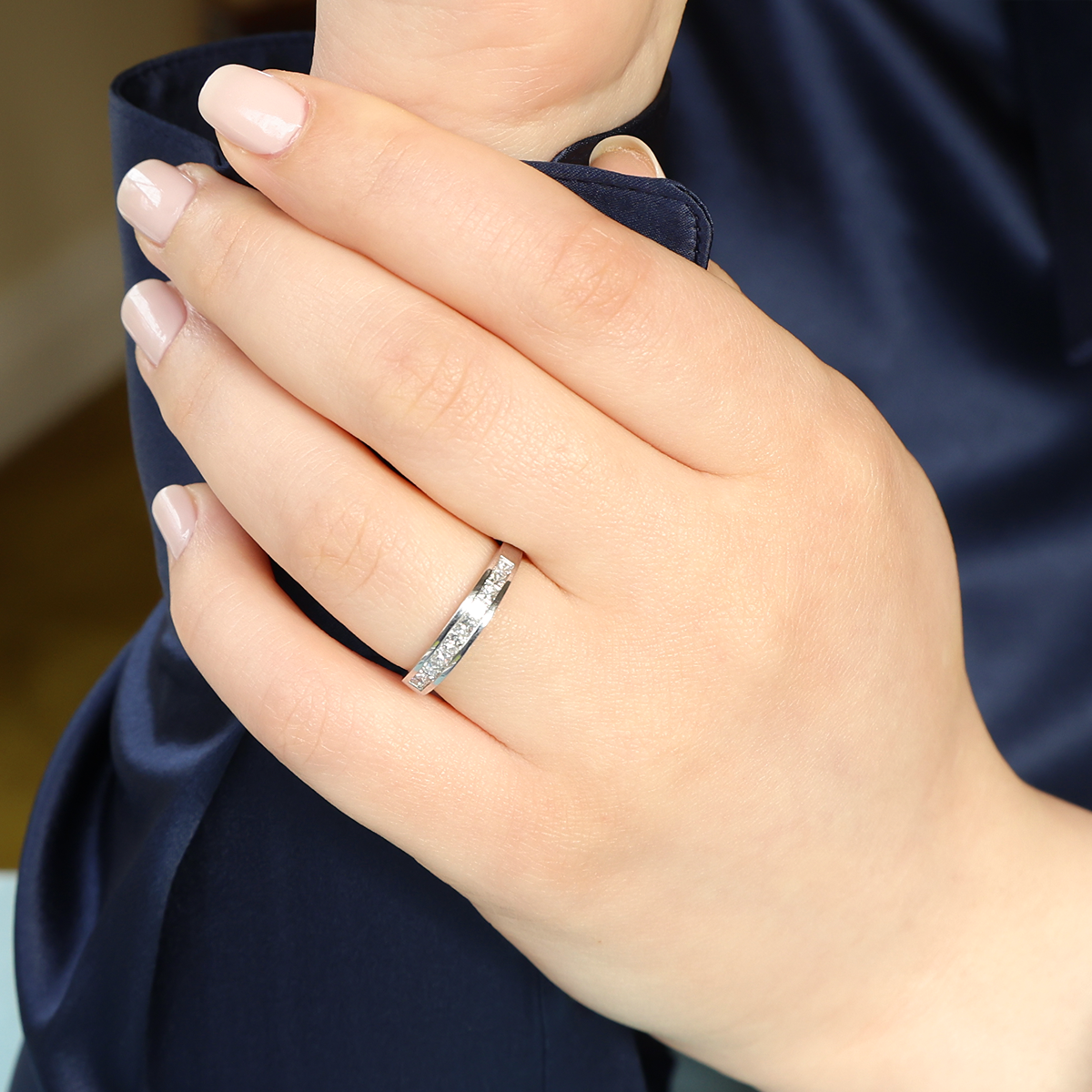 Model wears Platinum Princess Cut 0.50cts Diamond Channel Set Eternity Ring