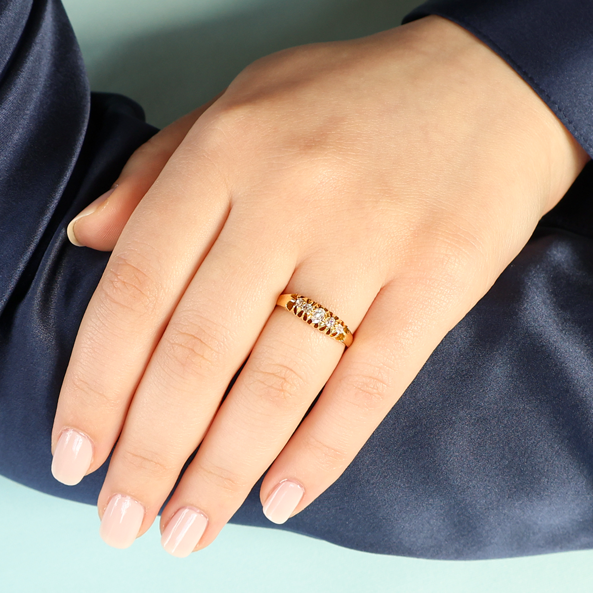 Model wears 18ct Yellow Gold Old Mine Cut Diamond Five Stone Victorian Ring