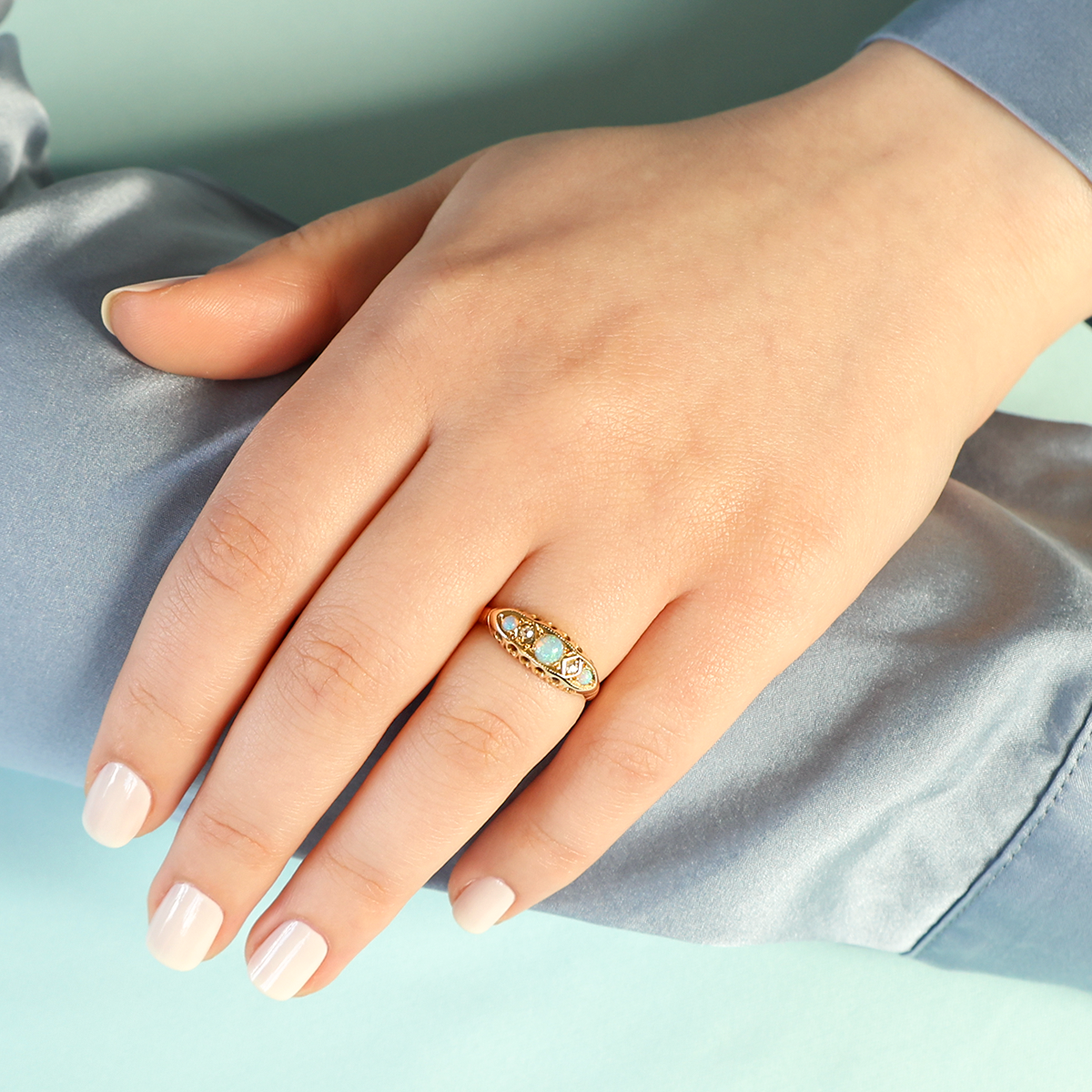 Model wears 18ct Yellow Gold Opal & Diamond Five Stone Ring