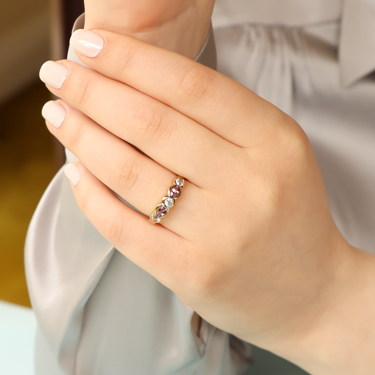 Model wears 9ct Yellow Gold Blue Topaz & Amethyst Ring