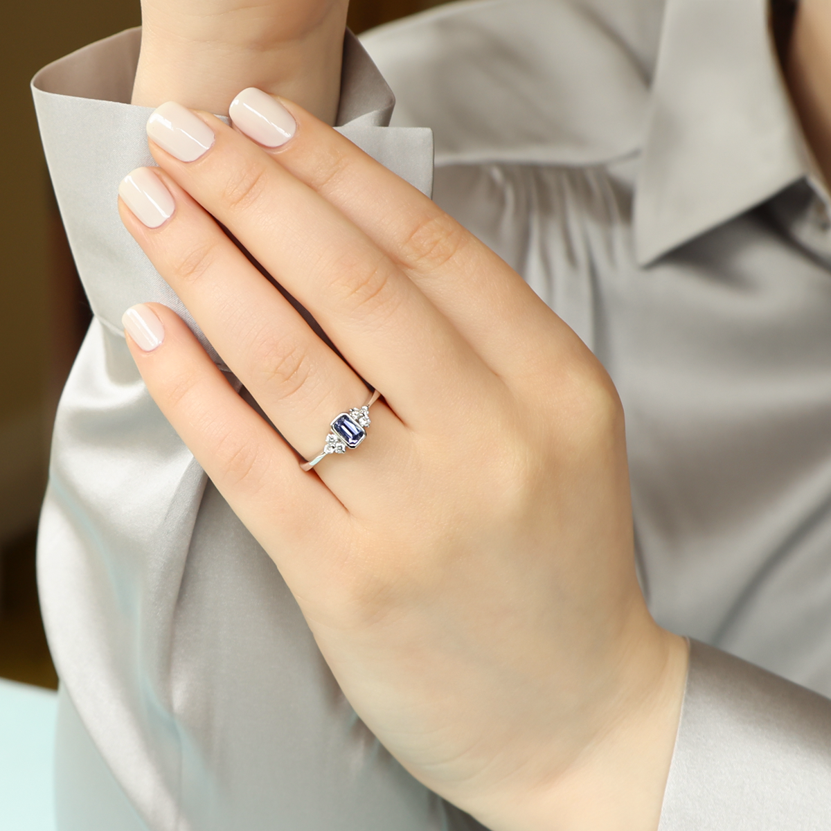 Model wears 18ct White Gold Tanzanite & Diamond Trefoil Ring