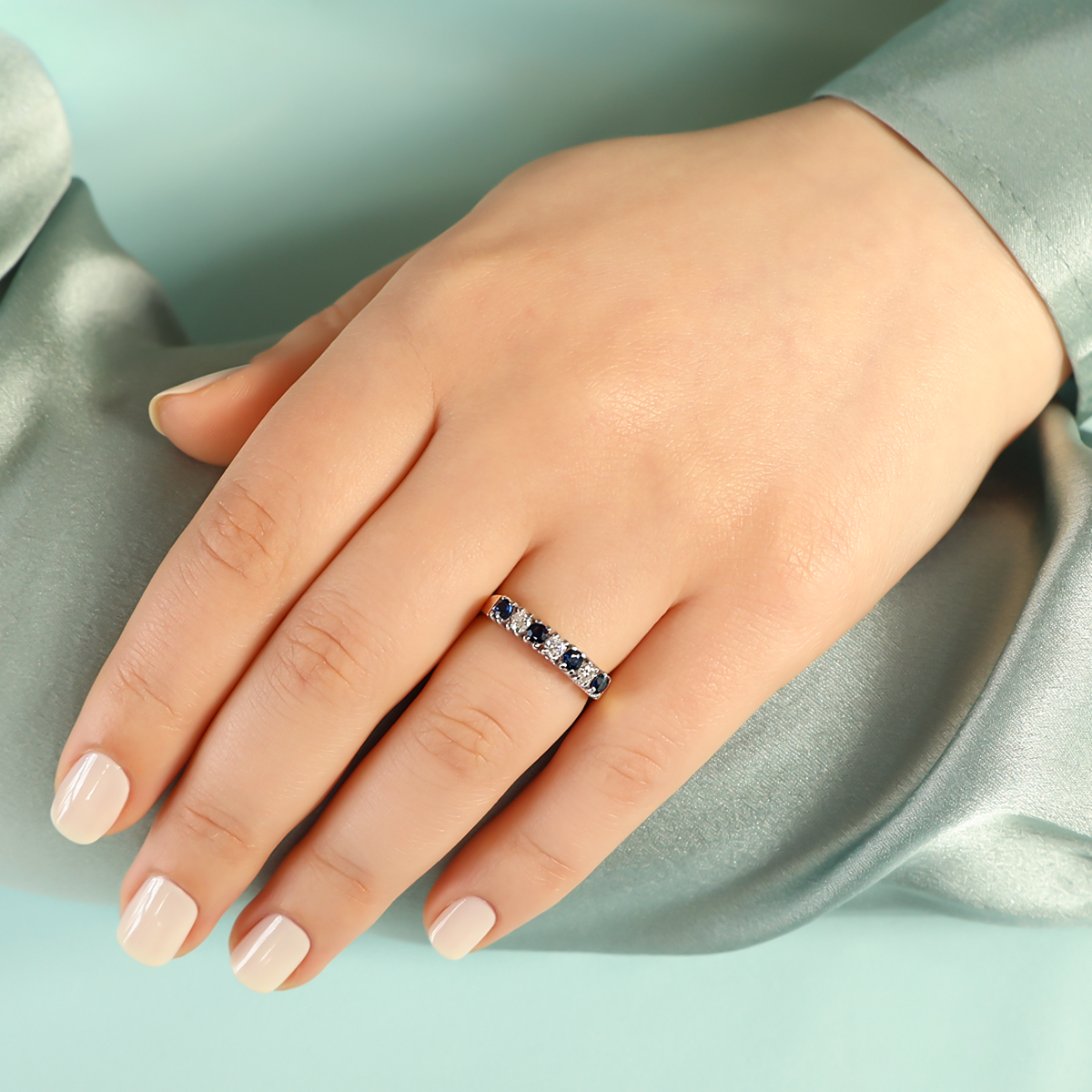 Model wears 18ct Yellow Gold Sapphire & Diamond Seven Stone Ring