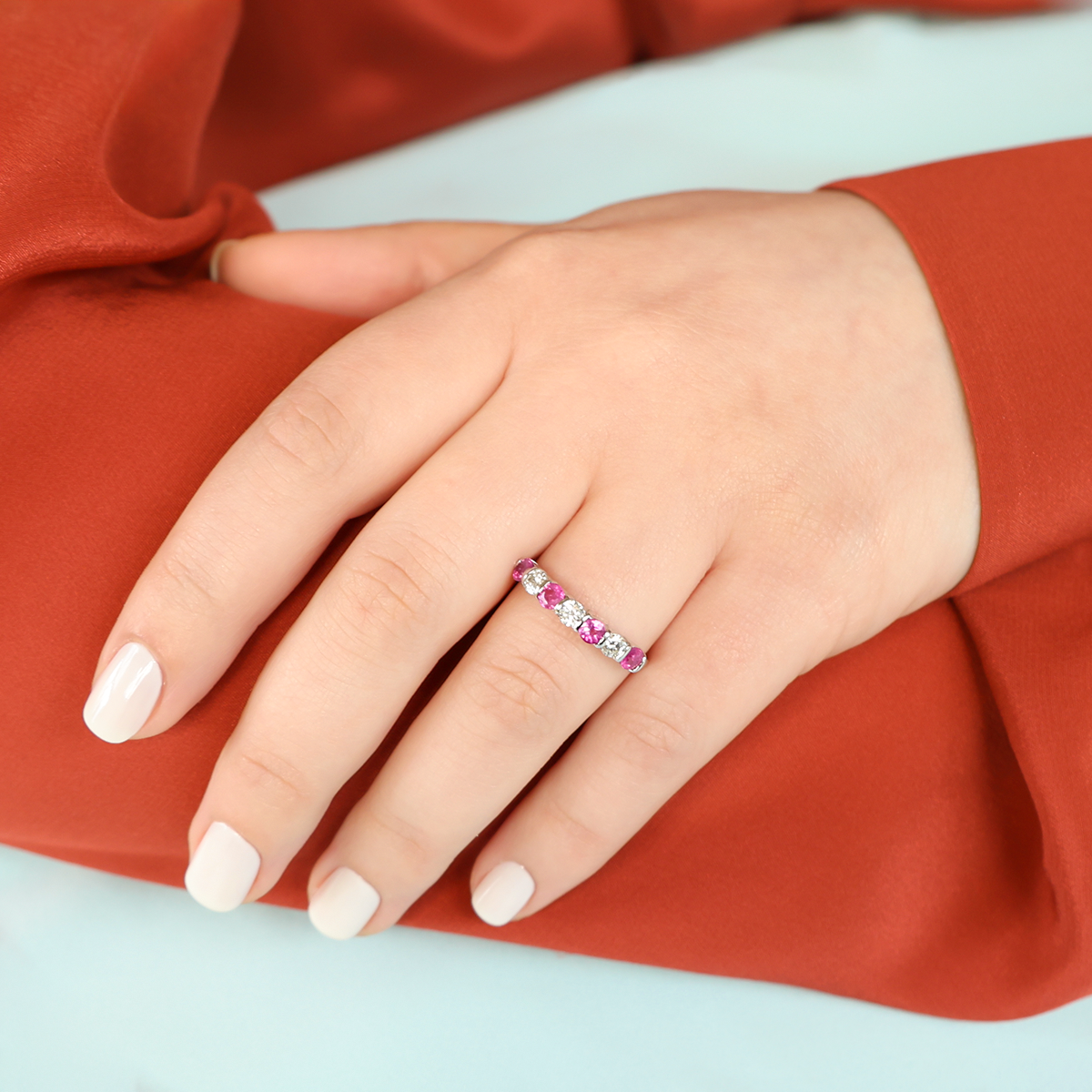 Model wears 9ct White Gold Ruby & Diamond Seven Stone Ring