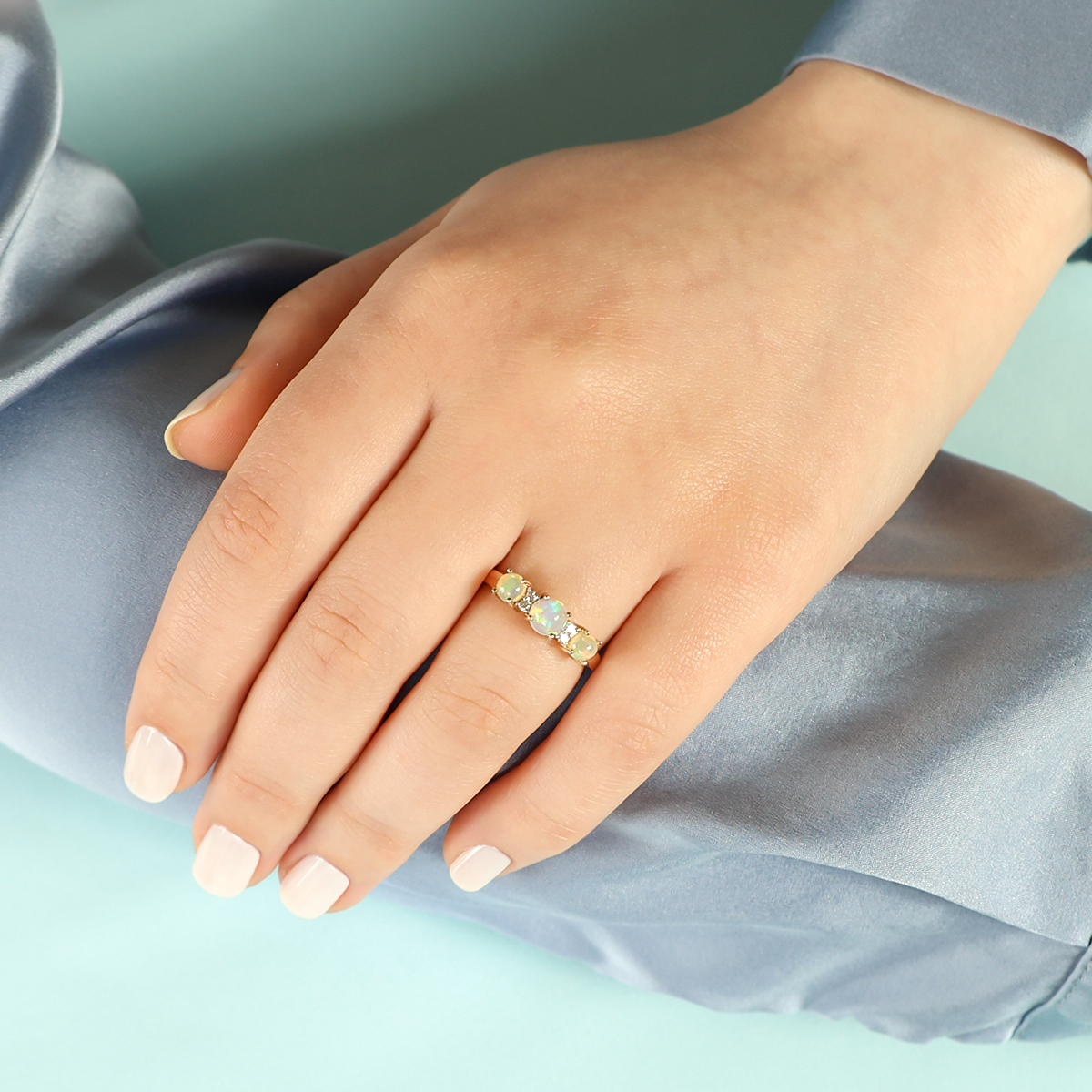 Model wears 9ct Yellow Gold Opal & Diamond Seven Stone Ring