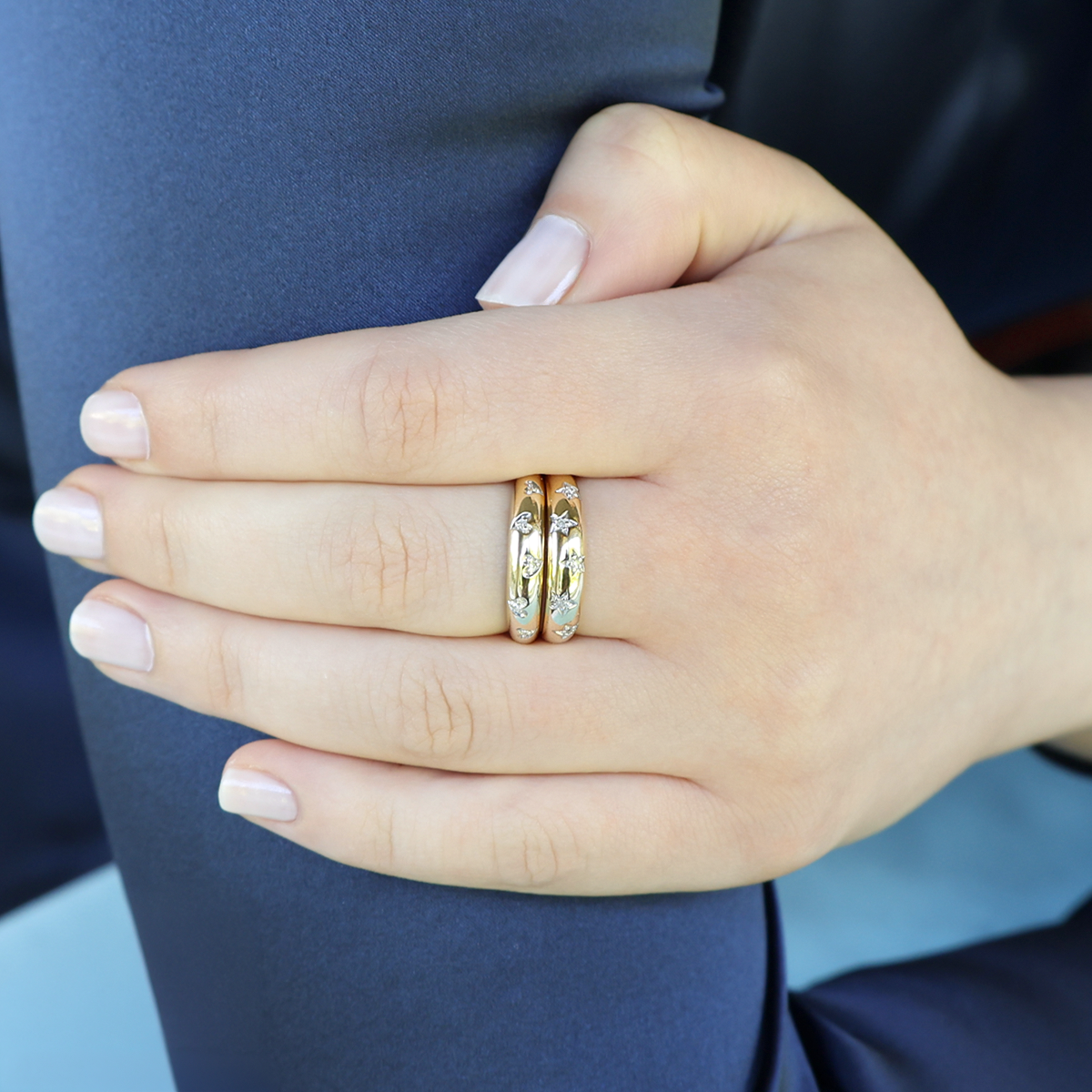 Model wears 9ct Yellow Gold Diamond Set Hearts Ring & 9ct Yellow Gold Diamond Set Stars Ring