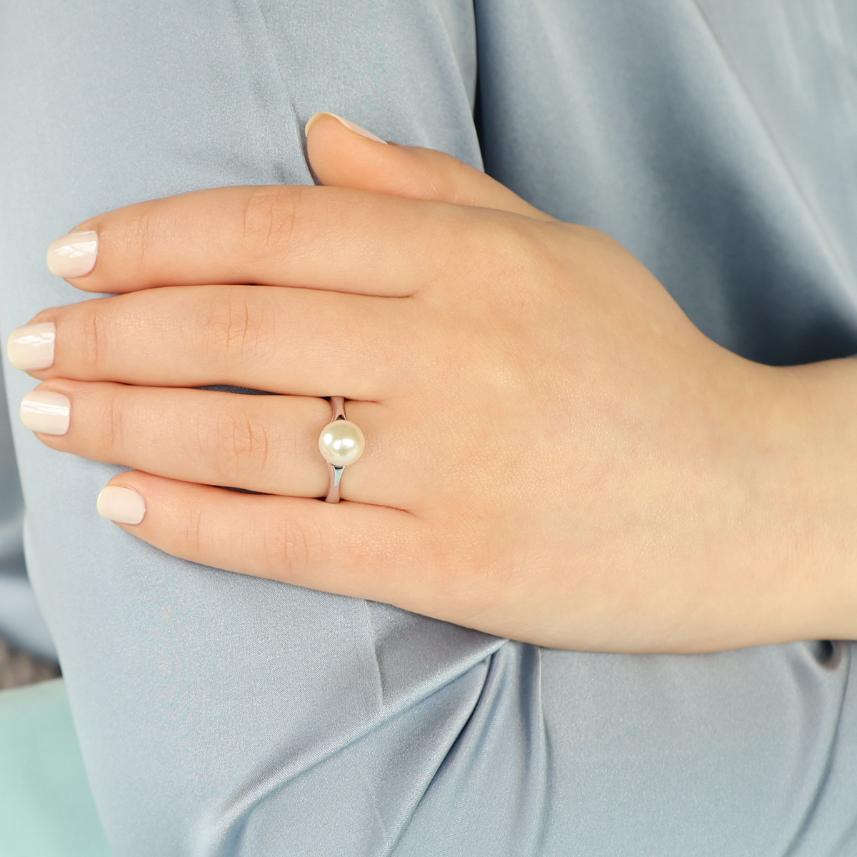 Model wears 18ct White Gold Cultured Round Pearl Solitaire Ring