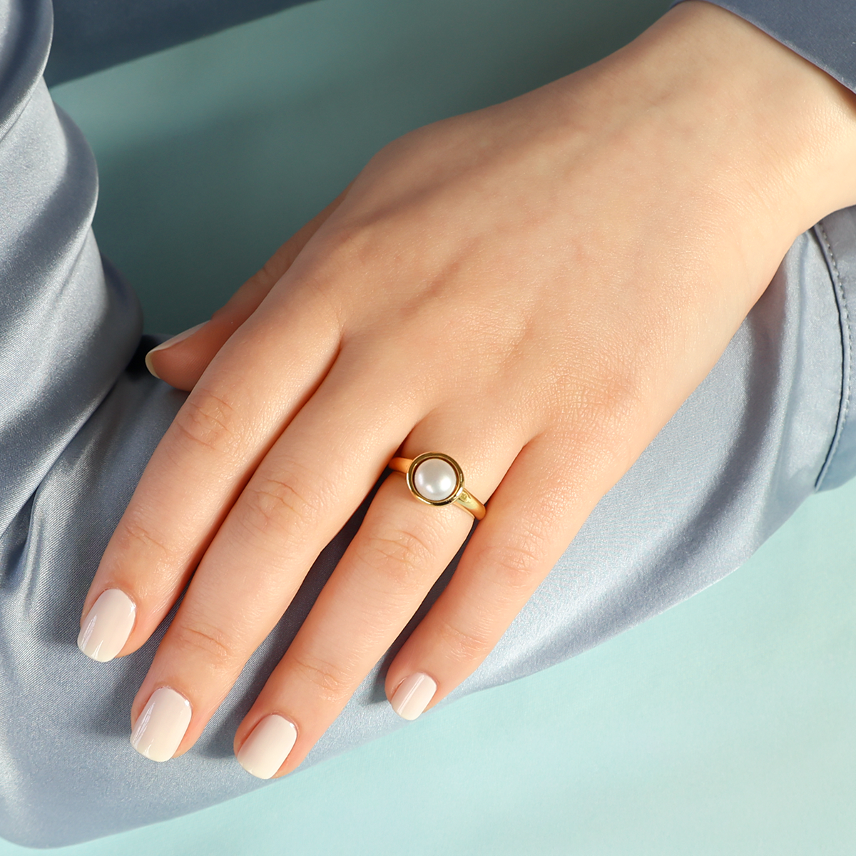 Model wears 18ct Yellow Gold Cultured Button Pearl Solitaire Ring