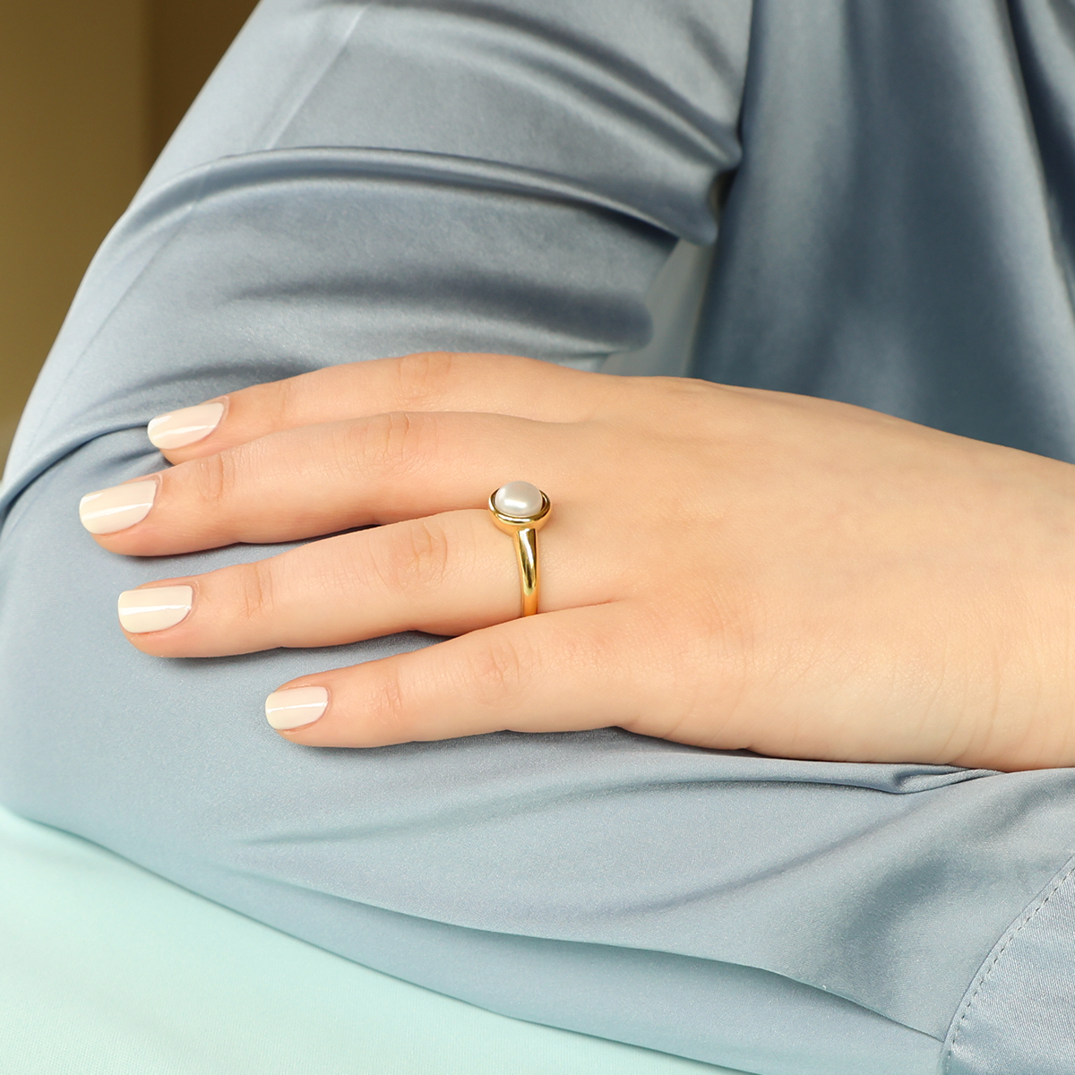 Model wears 18ct Yellow Gold Cultured Button Pearl Solitaire Ring