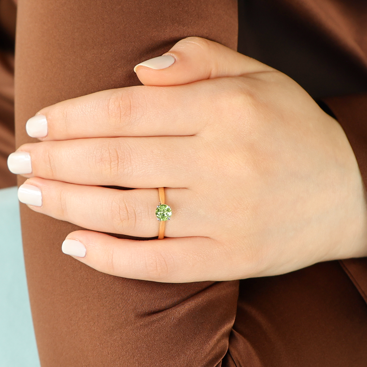 Model wears 18ct Yellow Gold Round Cut Peridot Solitaire Ring