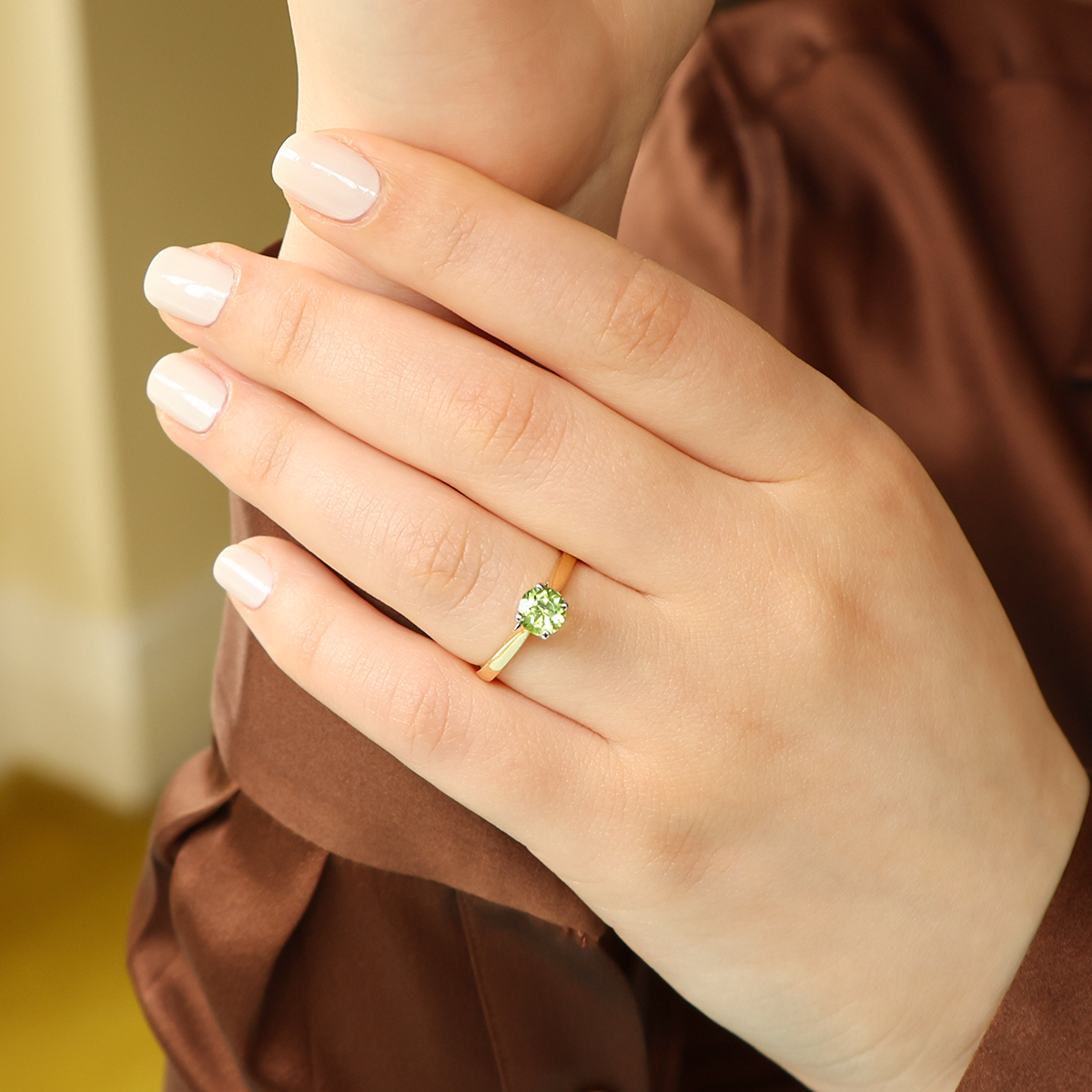Model wears 18ct Yellow Gold Round Cut Peridot Solitaire Ring