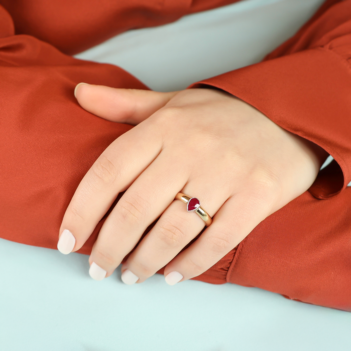 Model wears 9ct Yellow & White Gold Ruby Bezel Set Solitaire Ring