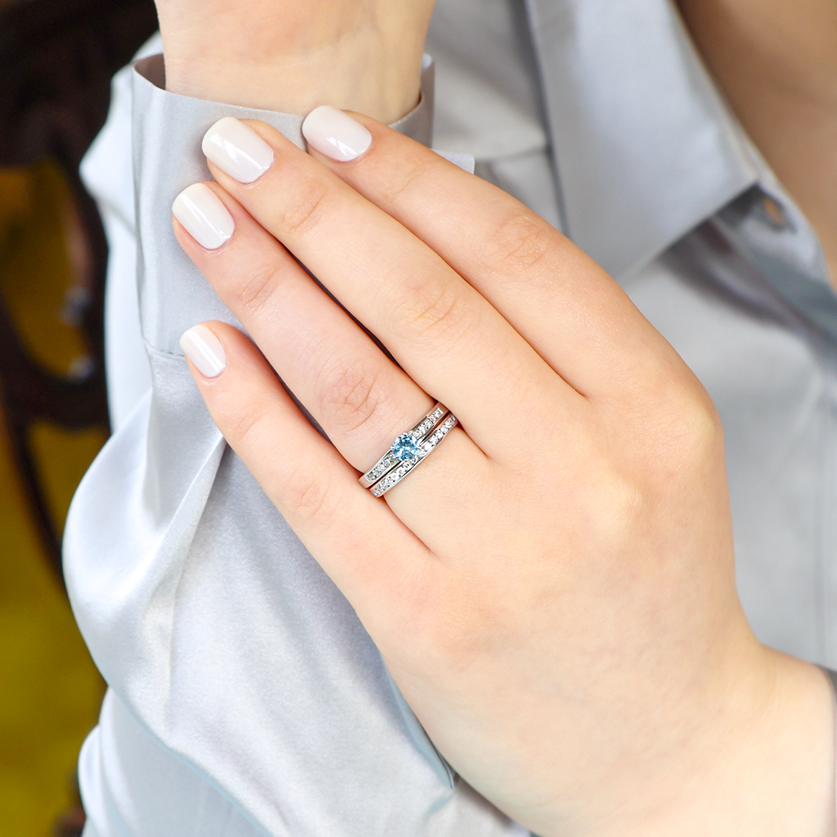 Model wears 18ct White Gold Aquamarine & Diamond Channel Set Shoulders Solitaire Ring