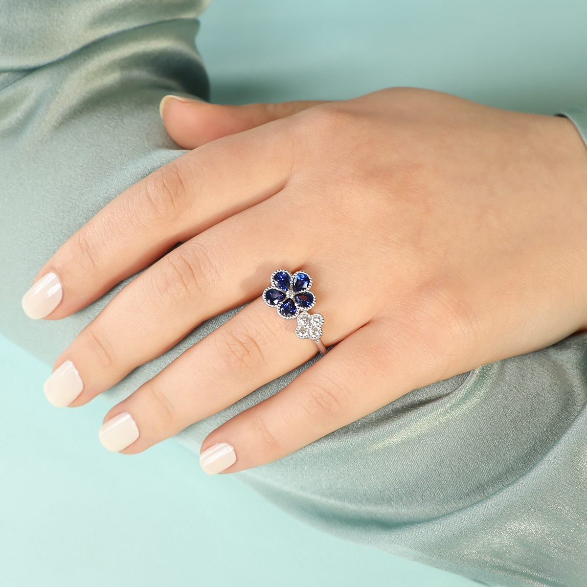 Model wears 18ct White Gold Sapphire & Diamond Flower Toi-et-Moi Ring
