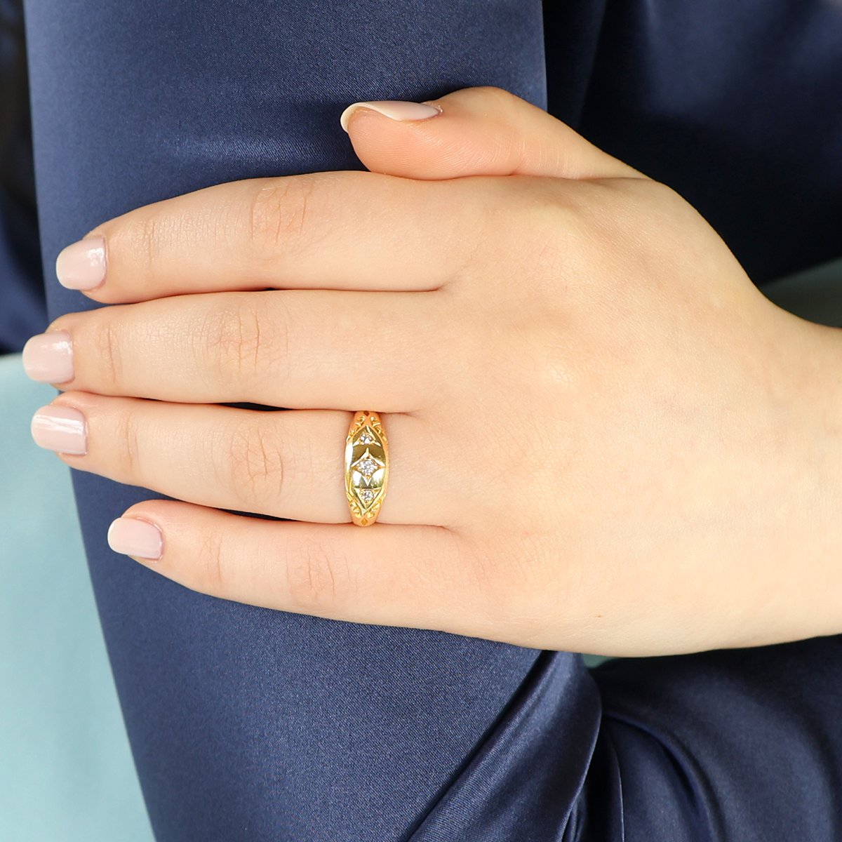 Model wears 18ct Yellow Gold Old Mine Cut Diamond Trilogy Edwardian Ring