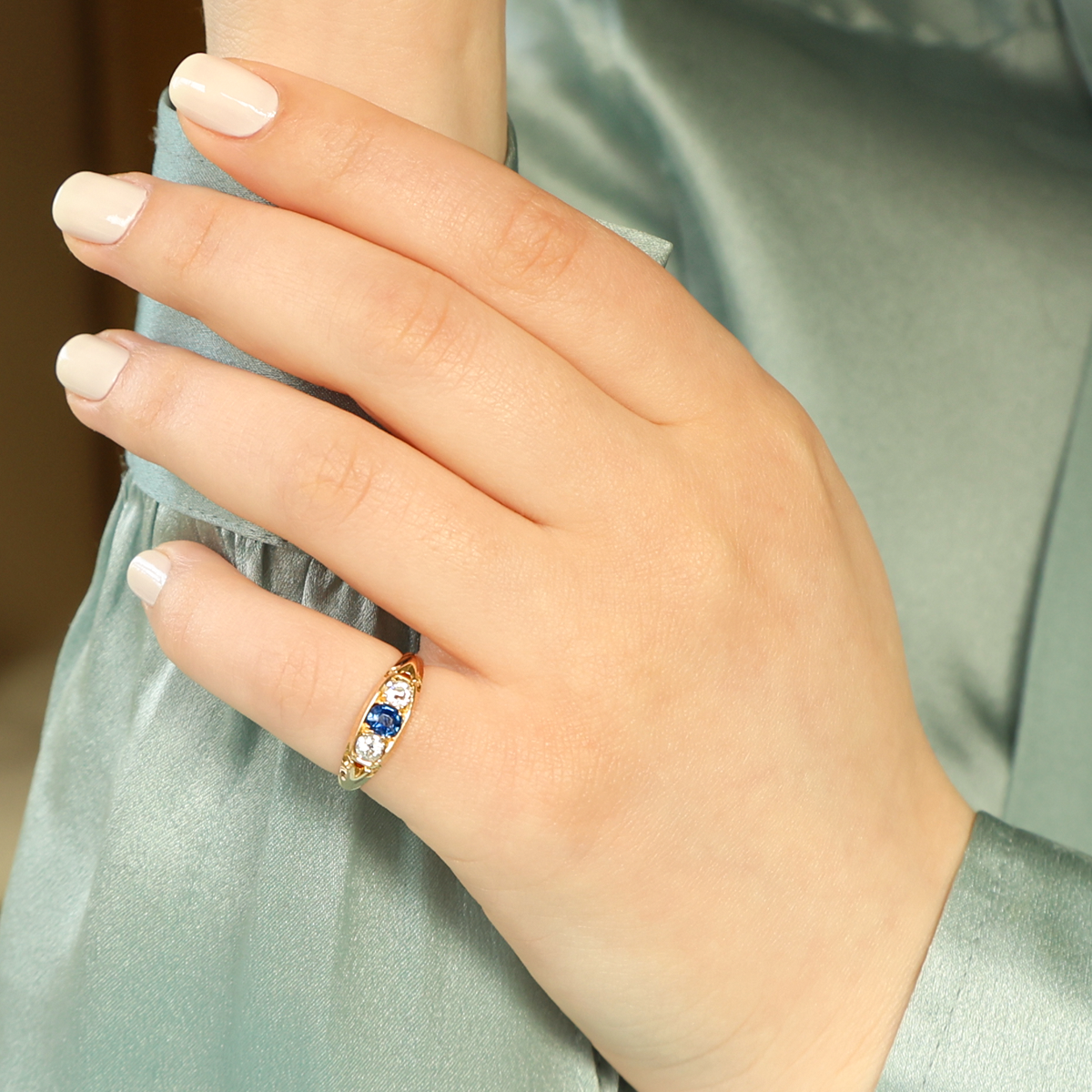 Model wears 18ct Yellow Gold Sapphire & Old Cut Diamond Trilogy Edwardian Ring