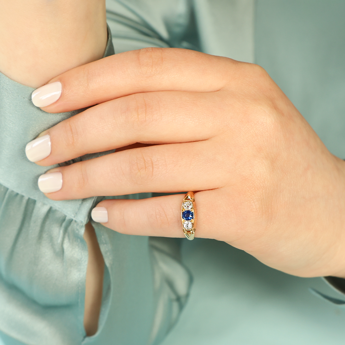 Model wears 18ct Yellow Gold Sapphire & Old Cut Diamond Trilogy Edwardian Ring