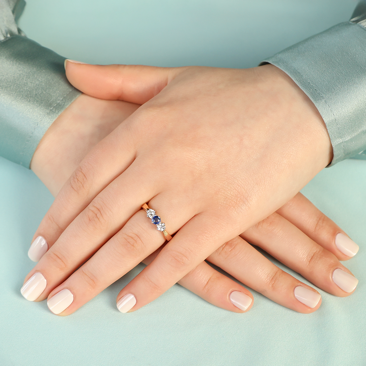 Model wears 18ct Yellow Gold Sapphire & Diamond Trilogy Ring