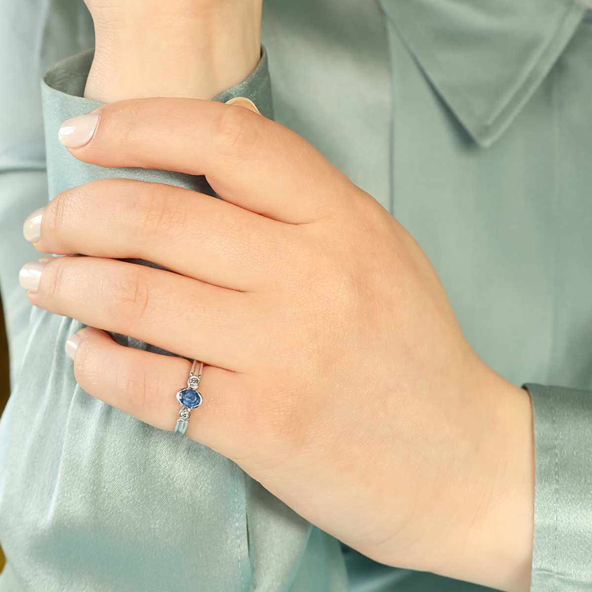 Model wears 9ct White Gold Sapphire & Diamond Bezel Set Trilogy Ring