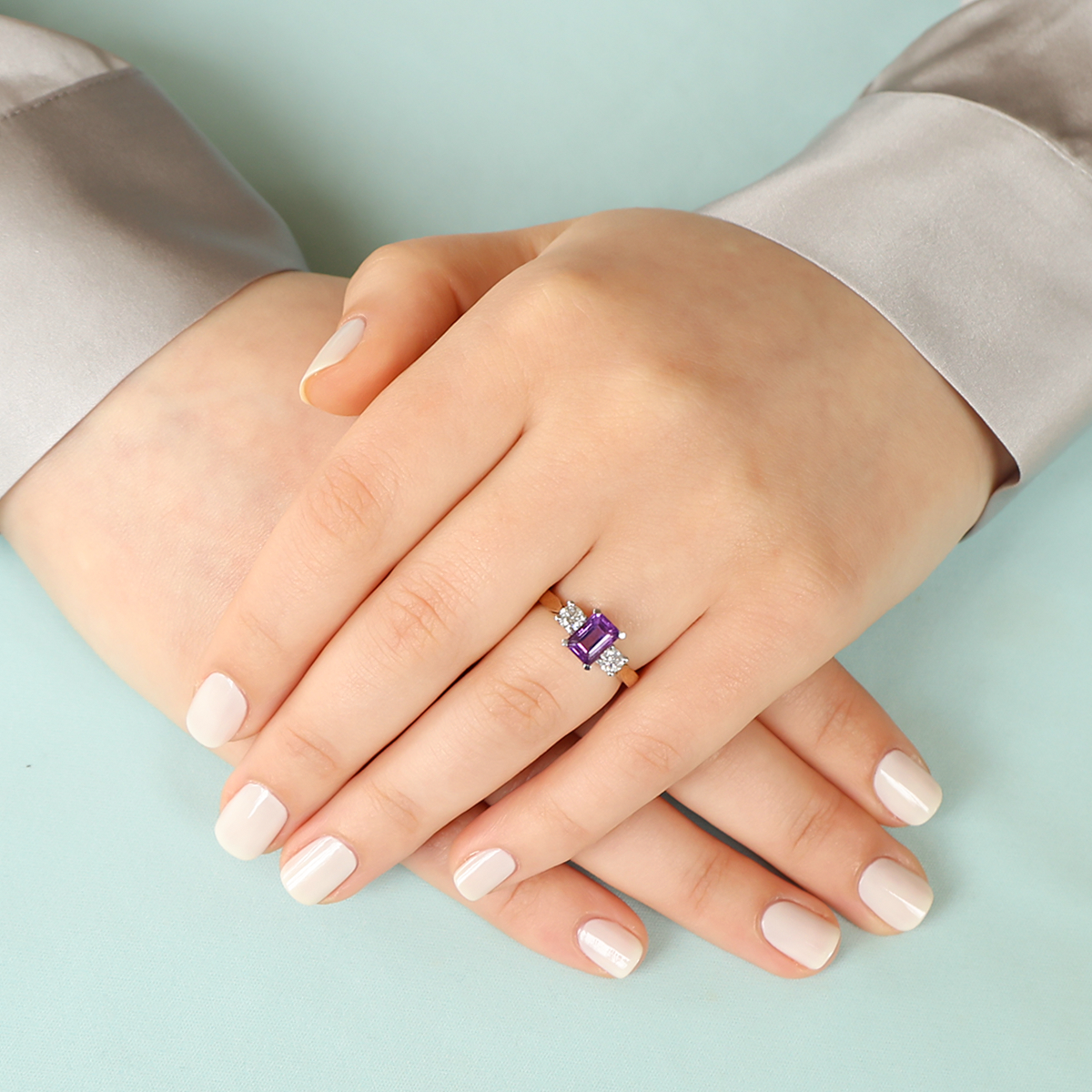 Model wears 9ct Yellow Gold Amethyst & Diamond Trilogy Ring
