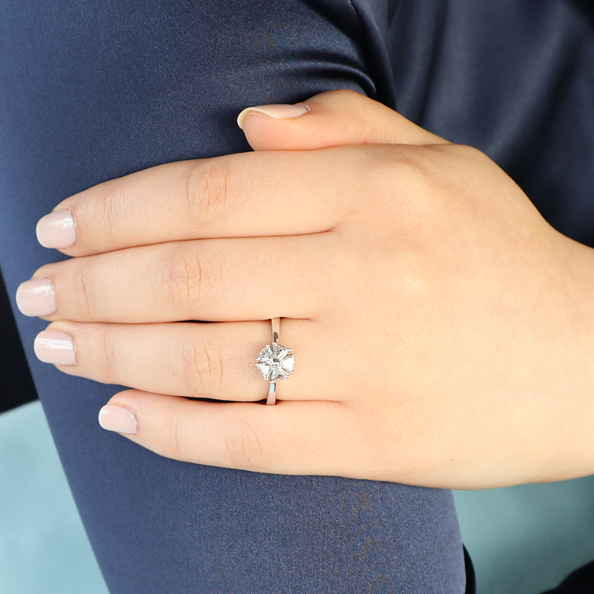 Model wears 18ct White Gold Trilliant Cut 0.65ct Diamond Flower Ring