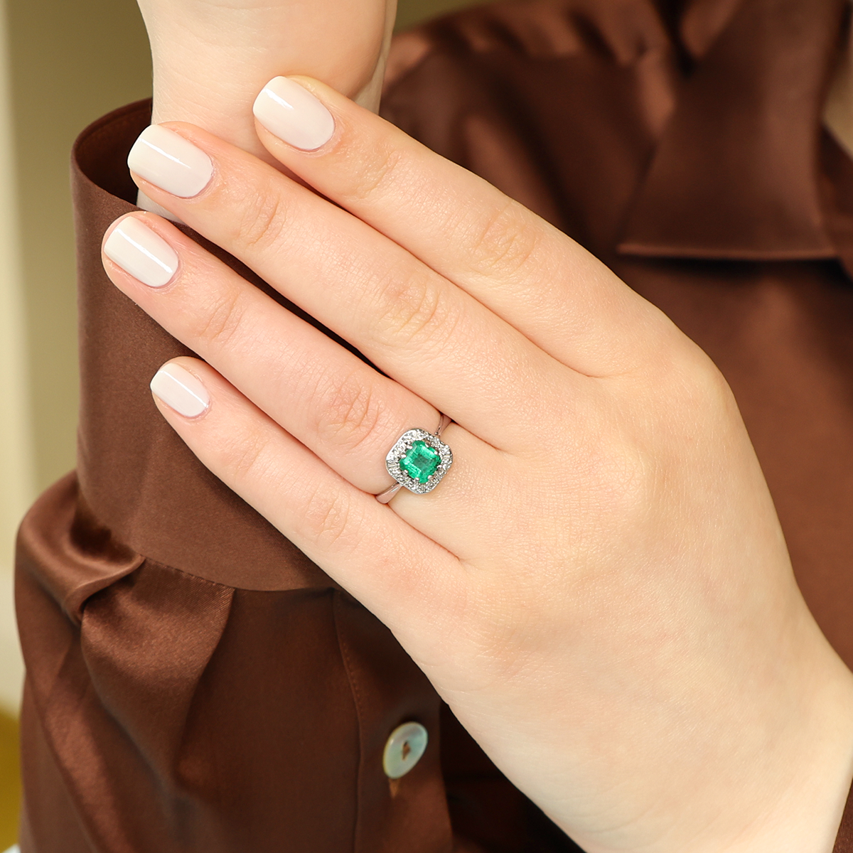 Model wears Platinum Asscher Cut Emerald & Diamond Cluster Ring