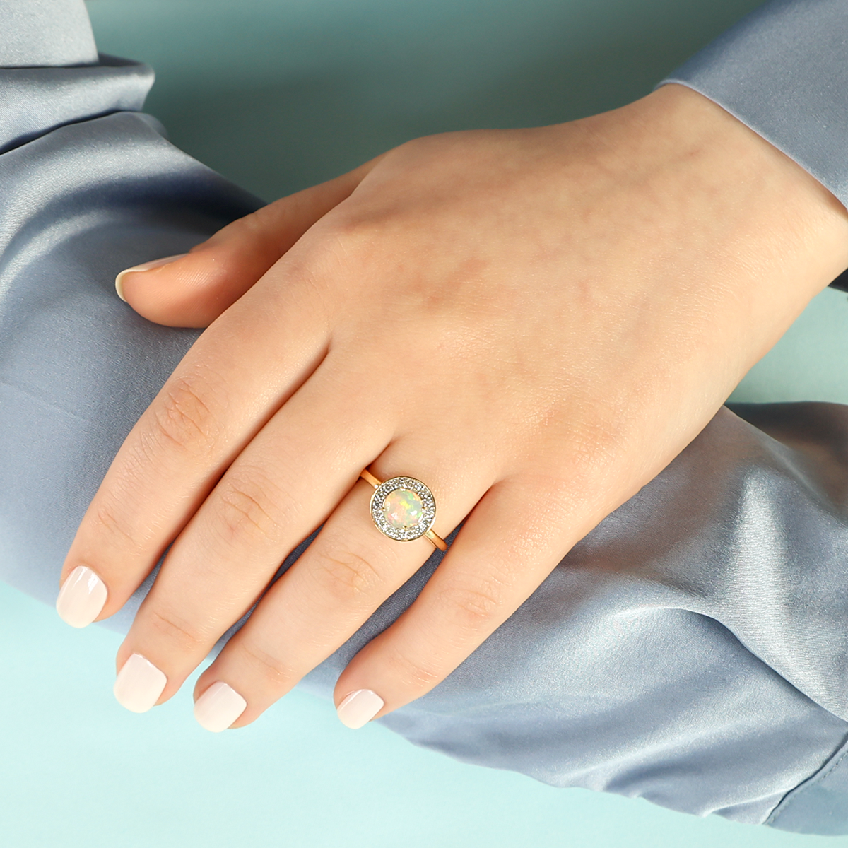 Model wears 18ct Yellow Gold Round Opal & Diamond Cluster Ring
