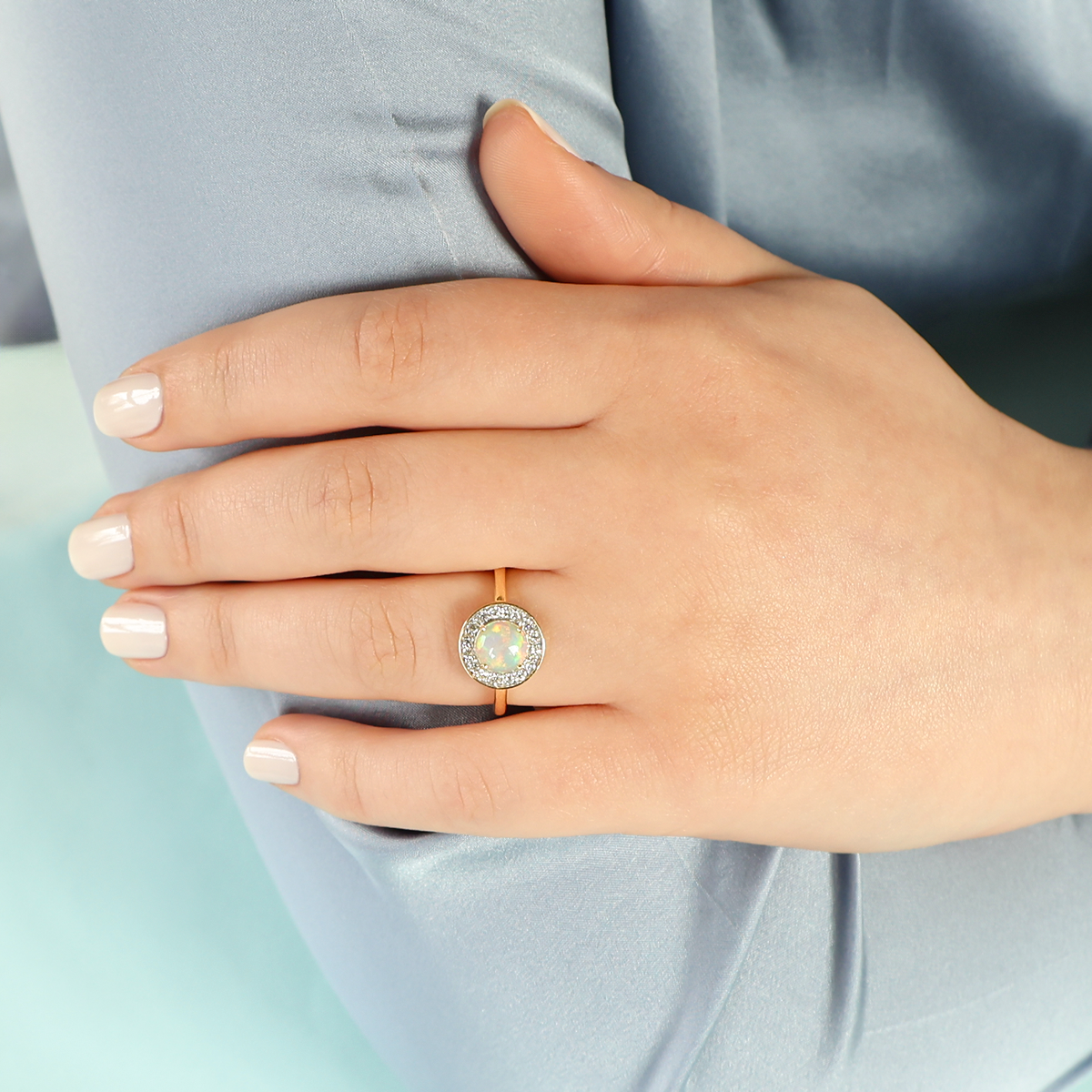 Model wears 18ct Yellow Gold Round Opal & Diamond Cluster Ring