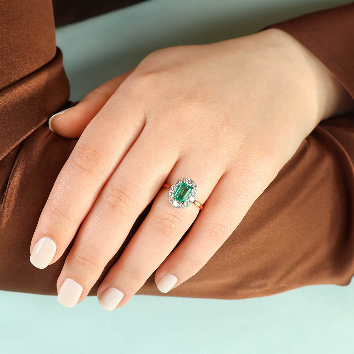 Model wears 18ct Yellow Gold & Platinum Emerald & Diamond Scalloped Cluster Ring