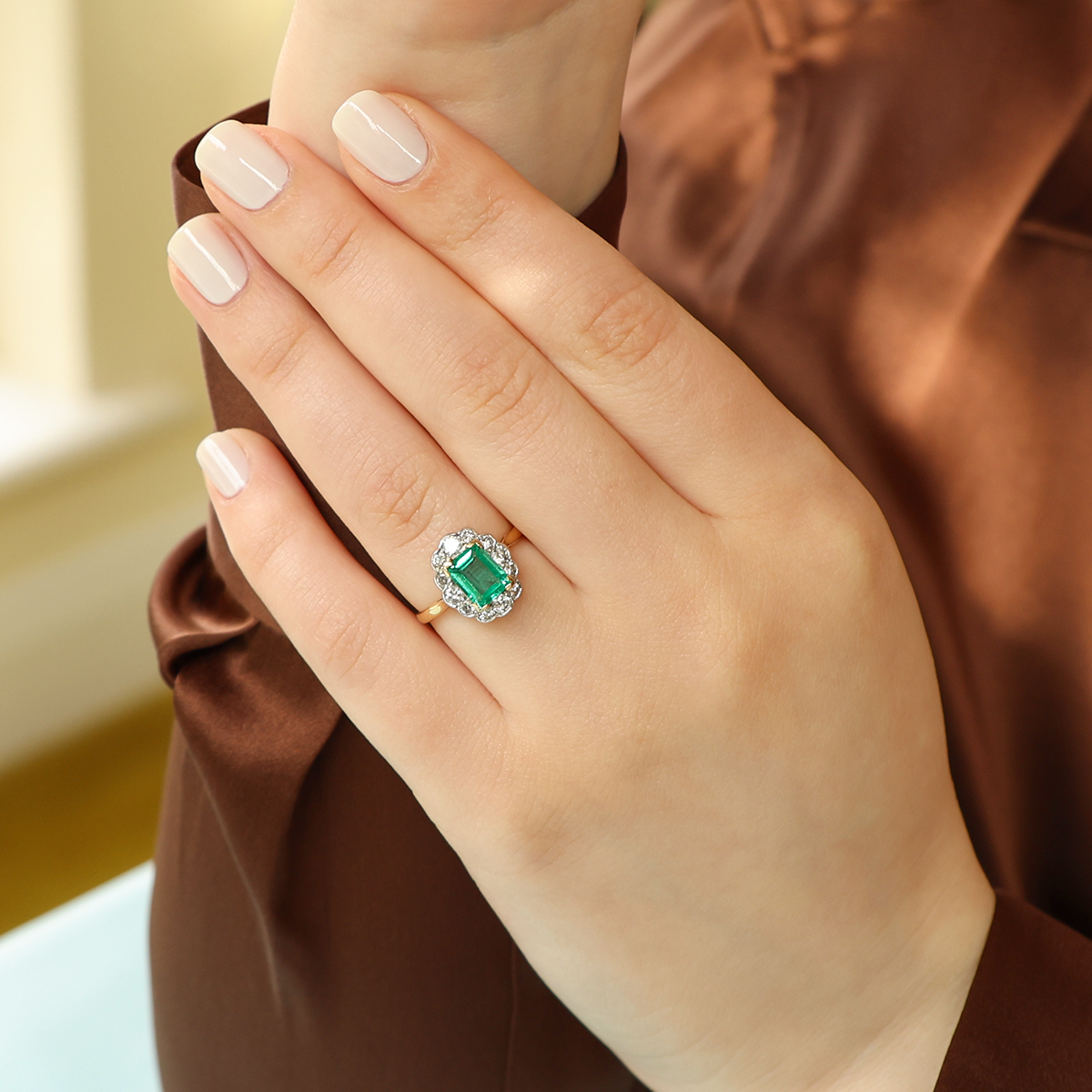 Model wears 18ct Yellow Gold & Platinum Emerald & Diamond Scalloped Cluster Ring