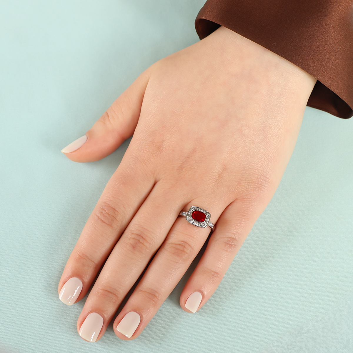 Model wears 9ct White Gold Oregon Sunstone & Diamond Cluster Ring