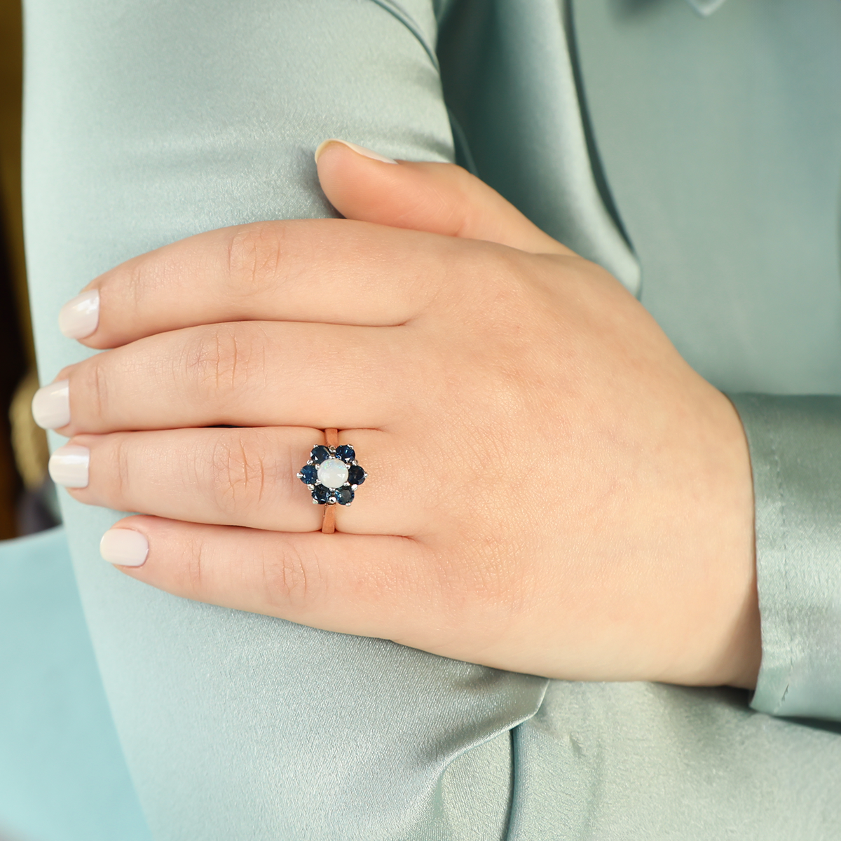Model wears 9ct Yellow Gold Sapphire & Opal Flower Cluster Ring