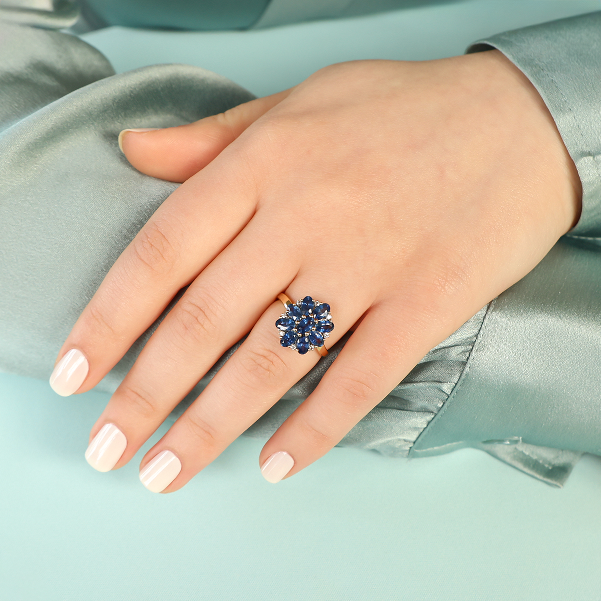 Model wears 9ct Yellow Gold Oval Shaped Sapphire & Diamond Cluster Ring