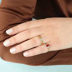 Model wears 9ct Three Colour Gold Flower Garland Ring & 9ct Yellow Gold Fire Opal & Diamond Cluster Ring