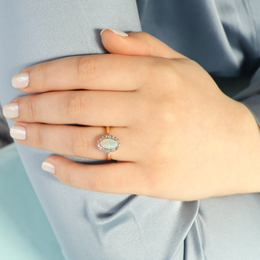 Model wears Un-hallmarked 9ct Yellow Gold Opal & Old Cut Diamond Cluster Ring