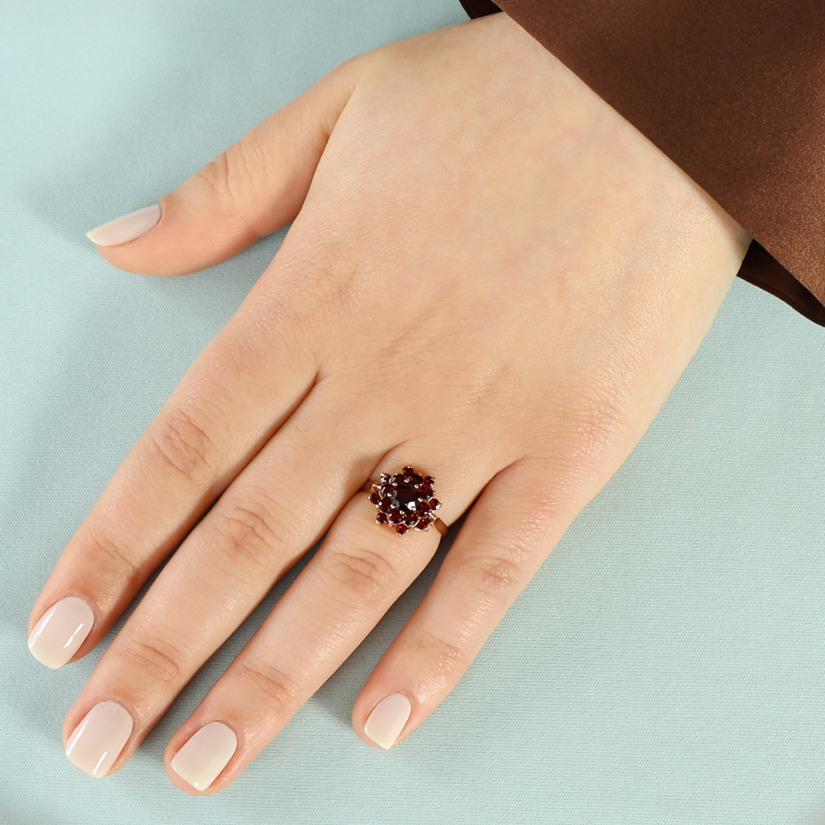 Model wears 9ct Yellow Gold Round Shaped Garnet Flower Cluster Ring