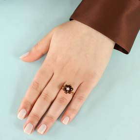 Model wears 9ct Yellow Gold Cultured Pearl & Garnet Flower Cluster Ring