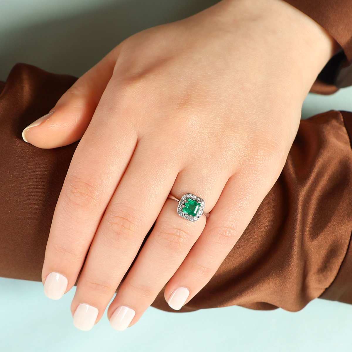 Model wears Platinum Asscher Cut Emerald & Diamond Cluster Ring