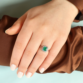 Model wears Platinum Asscher Cut Emerald & Diamond Cluster Ring