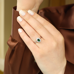 Model wears Platinum Oval Shaped Green Tourmaline & Diamond Cluster Ring