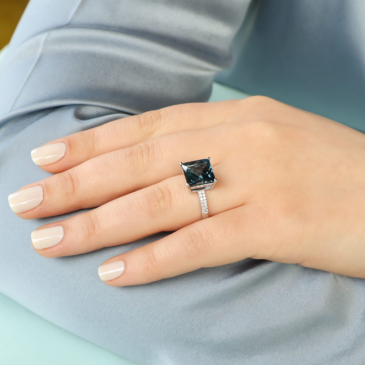 Model wears 9ct White Gold Square Cut London Blue Topaz & Diamond Cocktail Ring