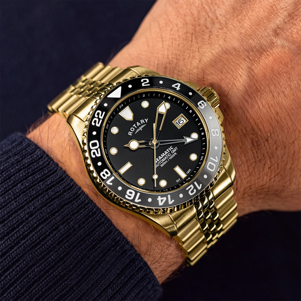Model wears Rotary Seamatic 300 GMT Automatic, Black Dial with Gold Plated Bracelet - RGB10006/04