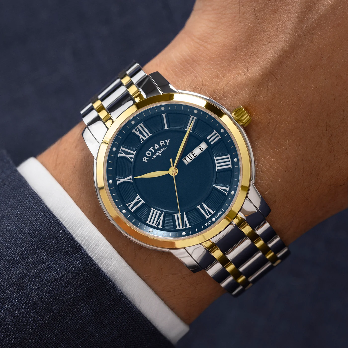 Model wears Rotary Heritage 2-Tone Watch, Blue Dial with Stainless Steel Bracelet RGB10021-05