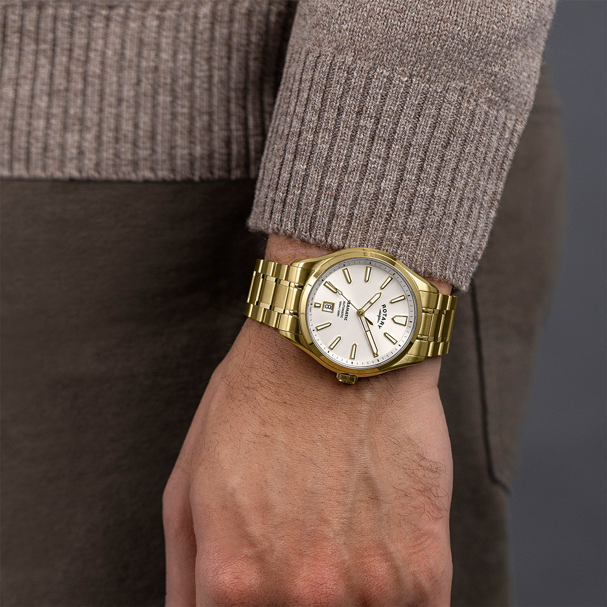 Model wears Rotary Seamatic 100 Automatic, White Dial with Gold Plated Bracelet RGB10036/06