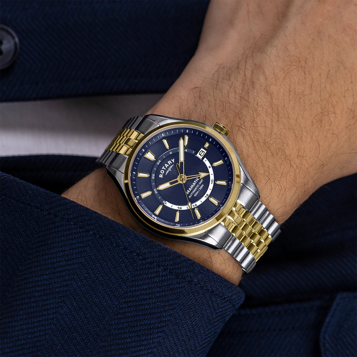 Model wears Rotary Seamatic 100 GMT Automatic 2-Tone Watch, Blue Dial with Stainless Steel Bracelet - RGB10042/05