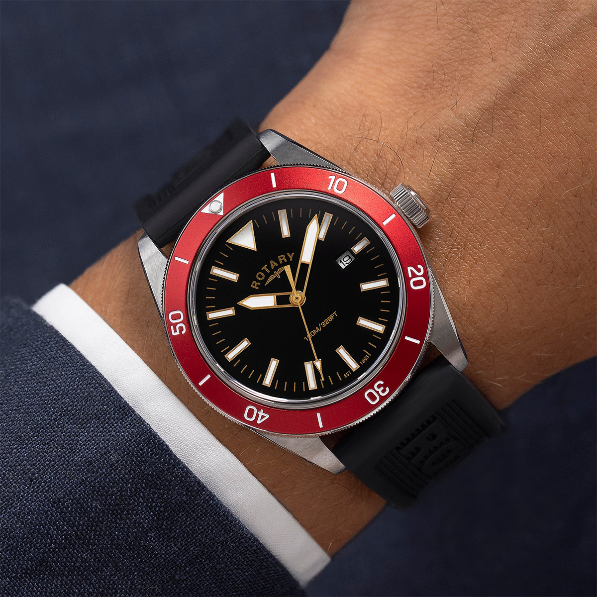 Model wears Rotary Apex 100, Red Bezel with Black Silicone Strap RGS10007/98