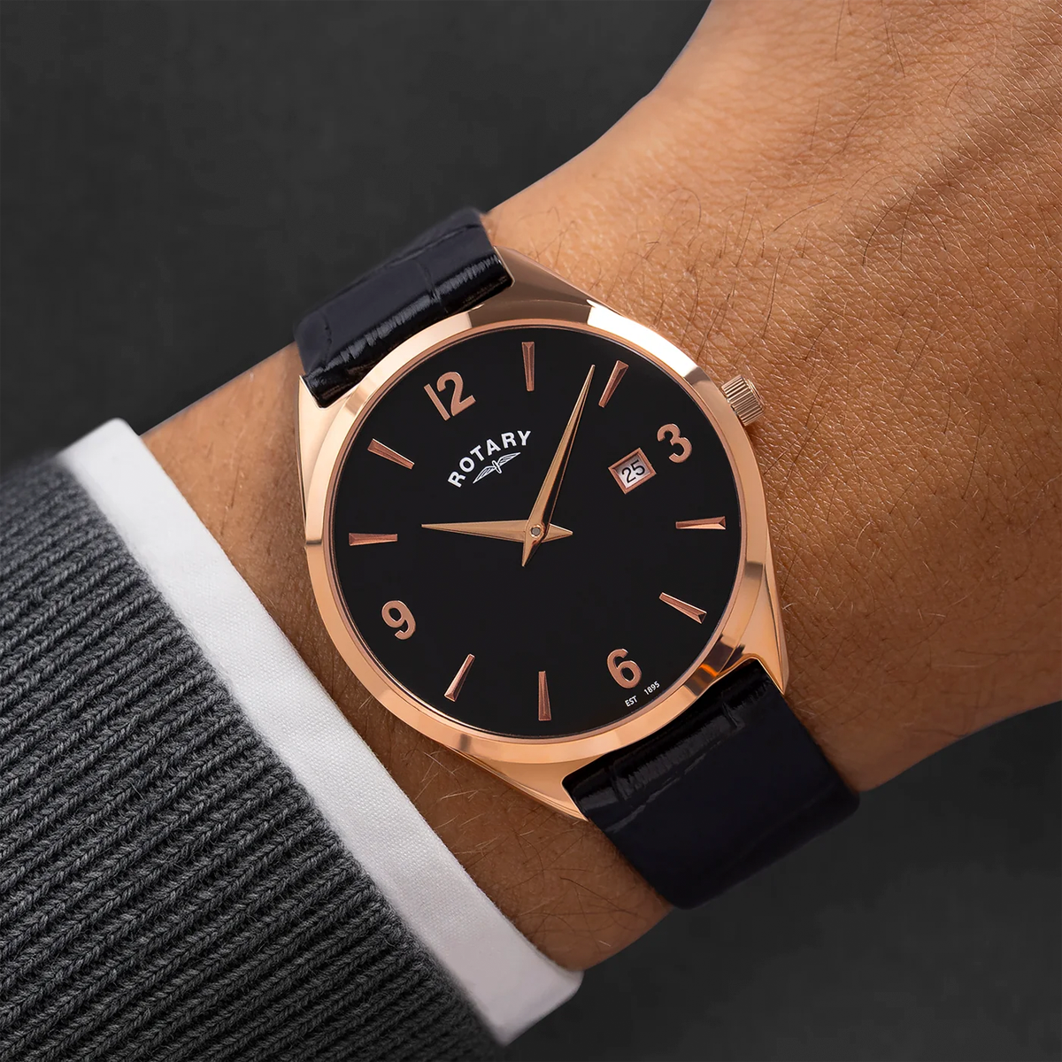 Model wears Rotary Ultra Slim Watch, Black Dial with Black Leather Strap RGS10012/04