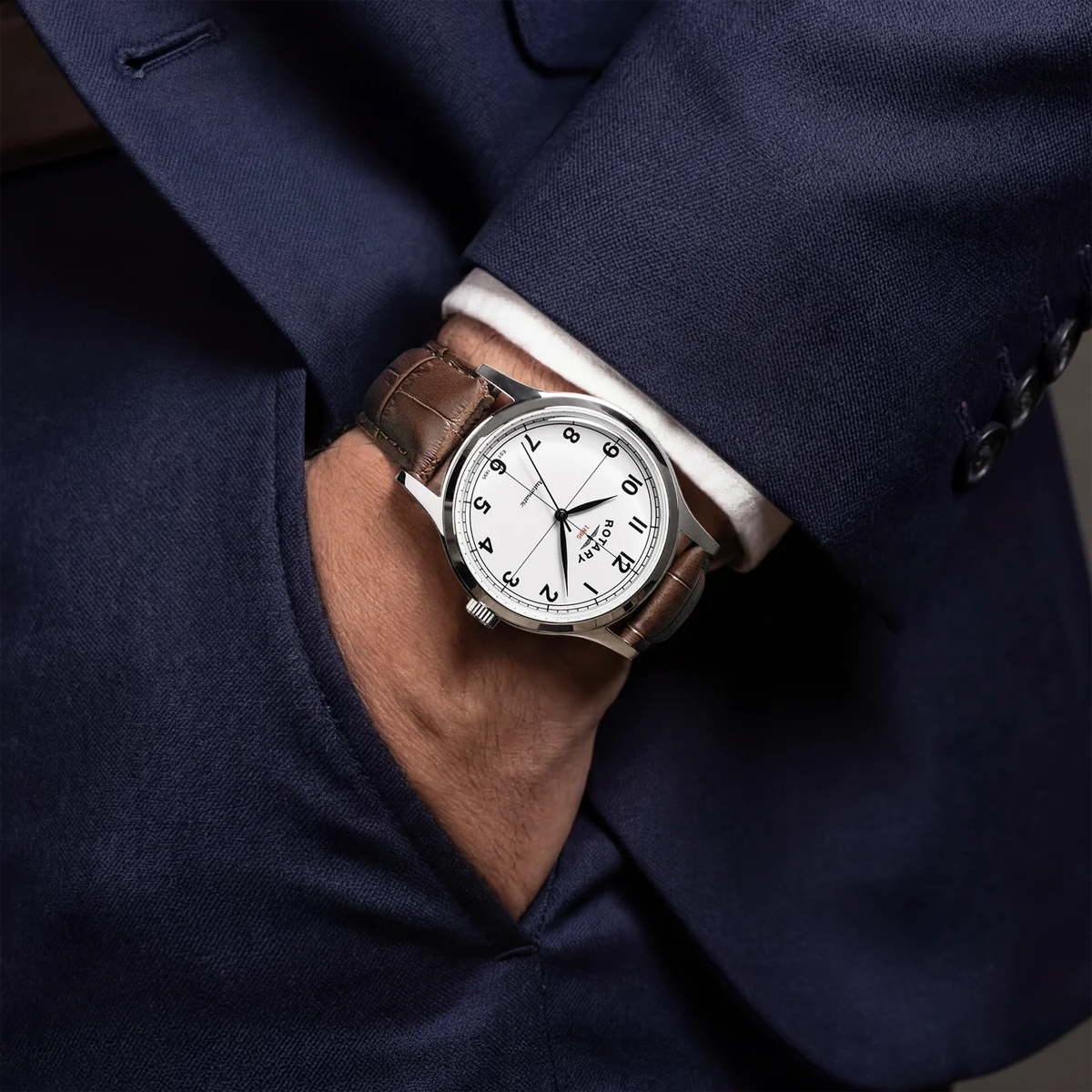 Model wears Rotary 1895 Automatic, White Dial with Brown Leather Strap RGS10081/01