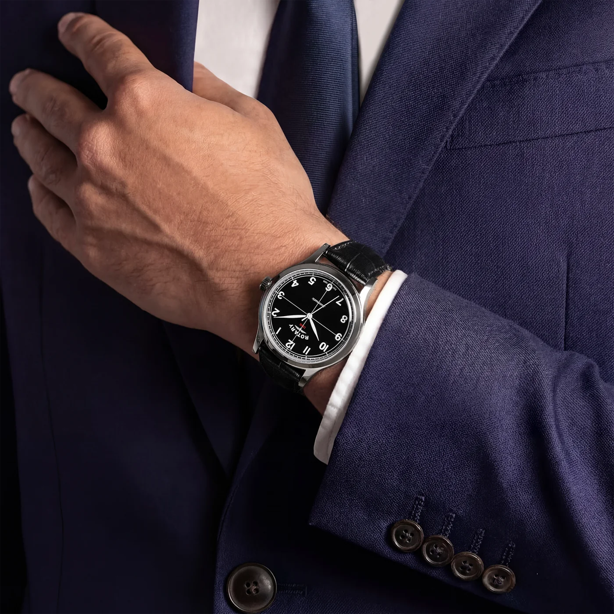 Model wears Rotary 1895 Automatic, Black Dial with Black Leather Strap RGS10081/04
