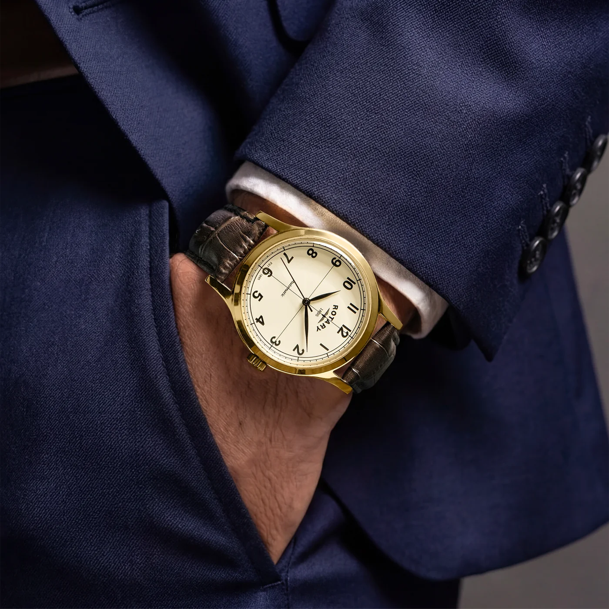 Model wears Rotary 1895 Automatic, Champagne Dial with Brown Leather Strap RGS10082/03