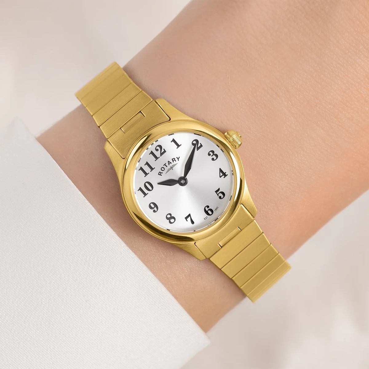 Model wears Rotary Heritage Altera, Round White Dial with Gold Plated Bracelet - RLB05762/22